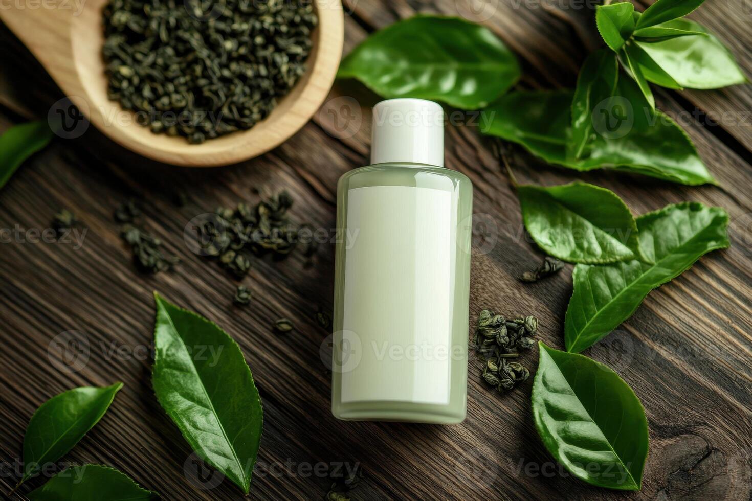 A bottle of lotion sits on a wooden table next to some green leaves photo