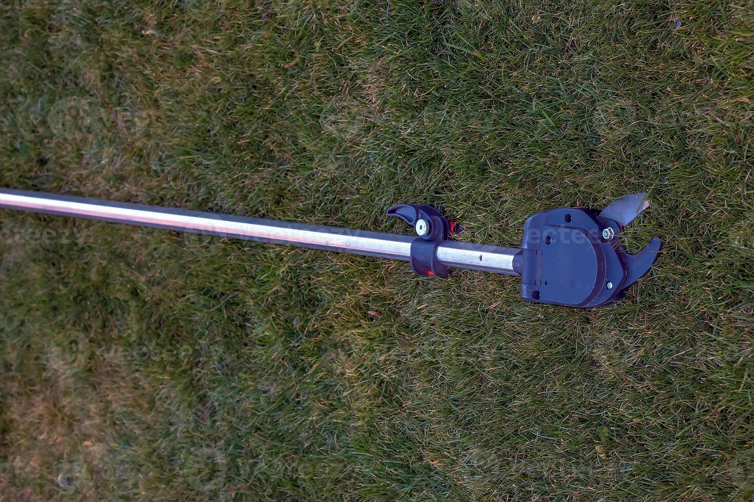 Garden pruner for high-altitude work. Close-up photo