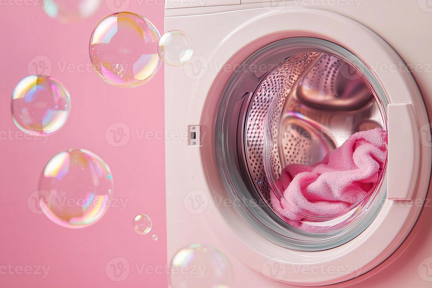 washing machine with soap bubbles on a soft pink background, concept of ecological washing products, gentle conditioner photo