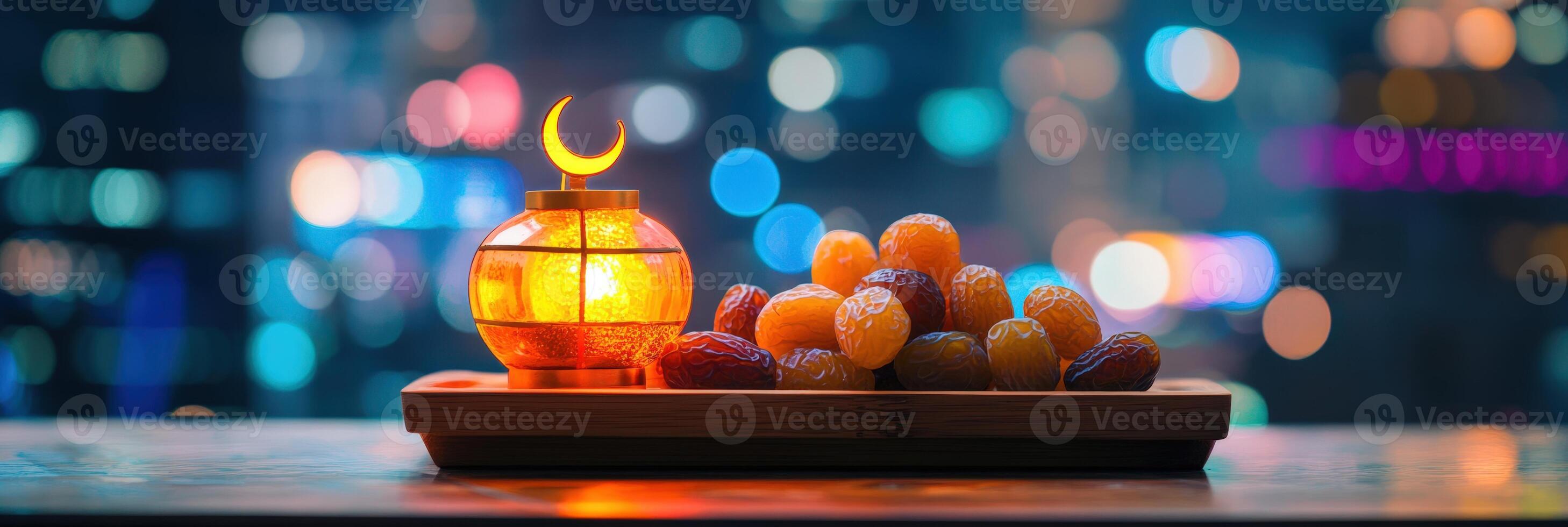 A candle lit on a tray of dates photo