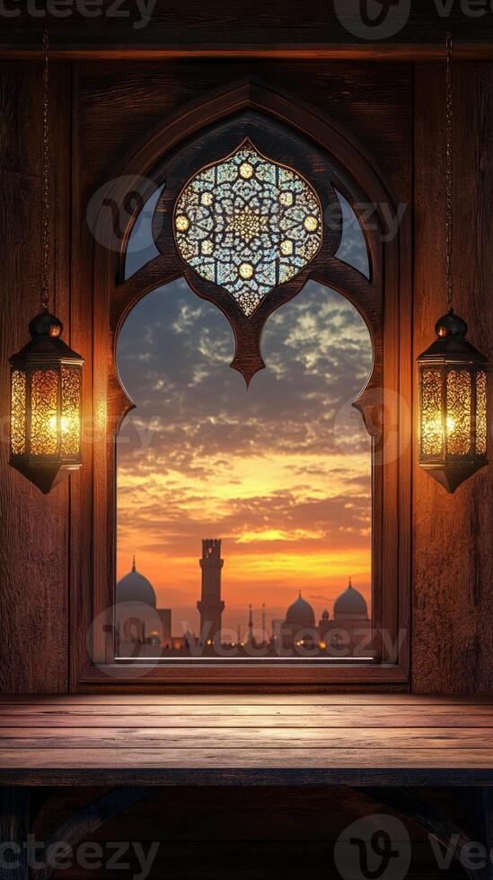 An old window with a view of the sunset photo