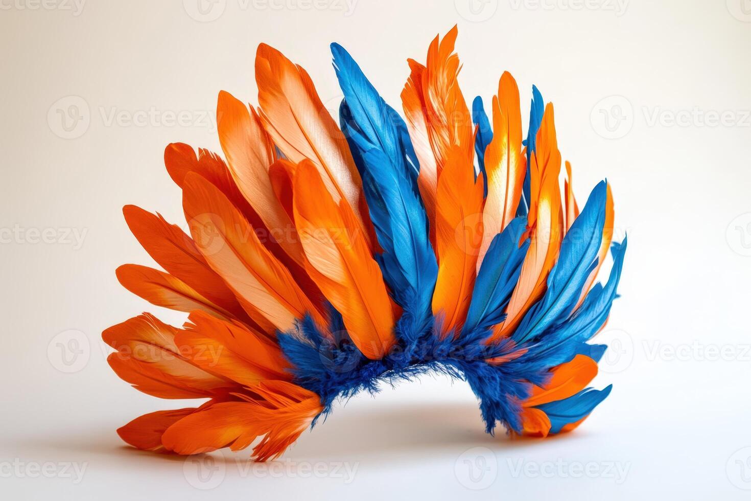 A feather headdress made of orange and blue feathers photo
