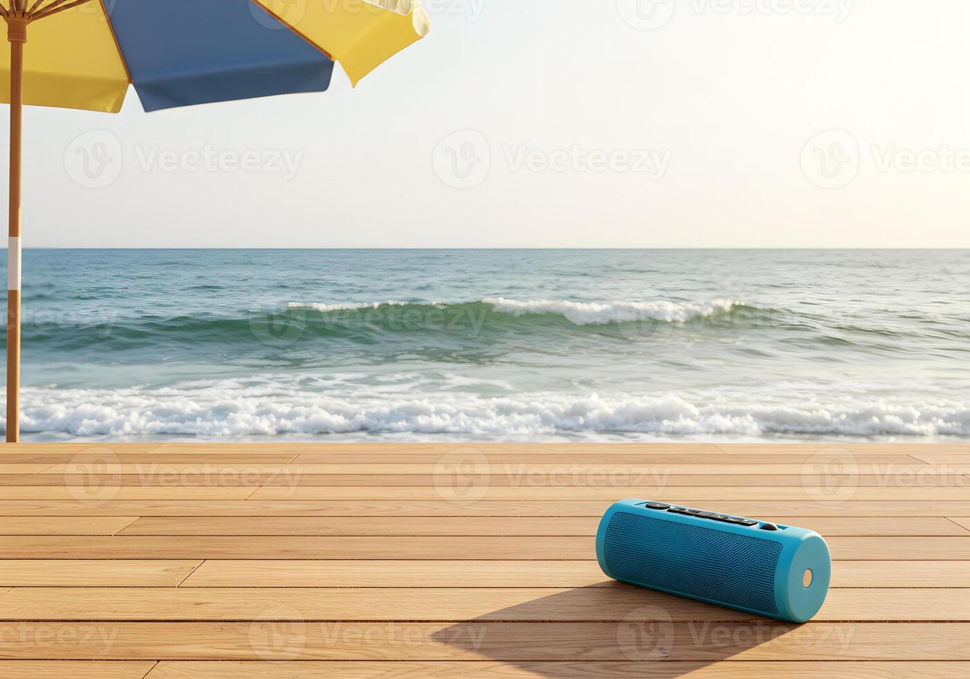 Oceanside Relaxation Portable Speaker on Wooden Deck Beneath Beach Umbrella photo