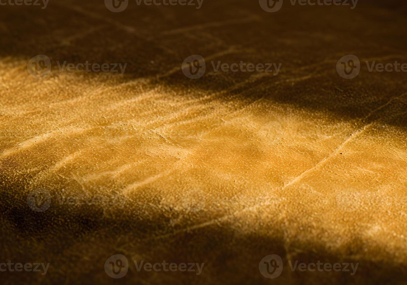 Golden Hues of Textured Leather Under Sunlight's Embrace photo
