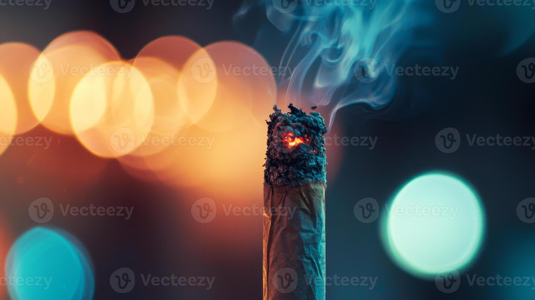 A close up of a lit cigarette with a bright light photo