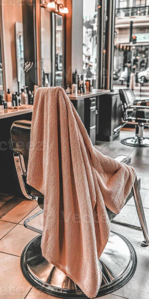 Soft microfiber towel draped over salon chair in bustling city shop photo