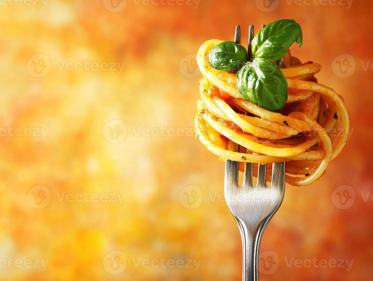 Delicious spaghetti with fresh basil on a fork with vibrant background photo