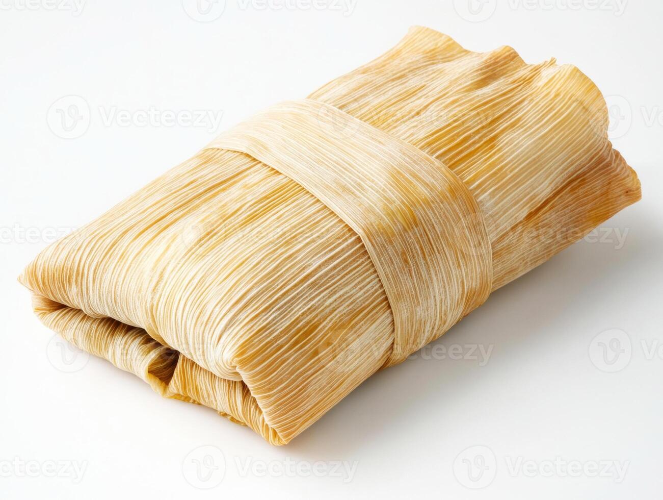 tamale wrapped in corn husks ready for serving photo