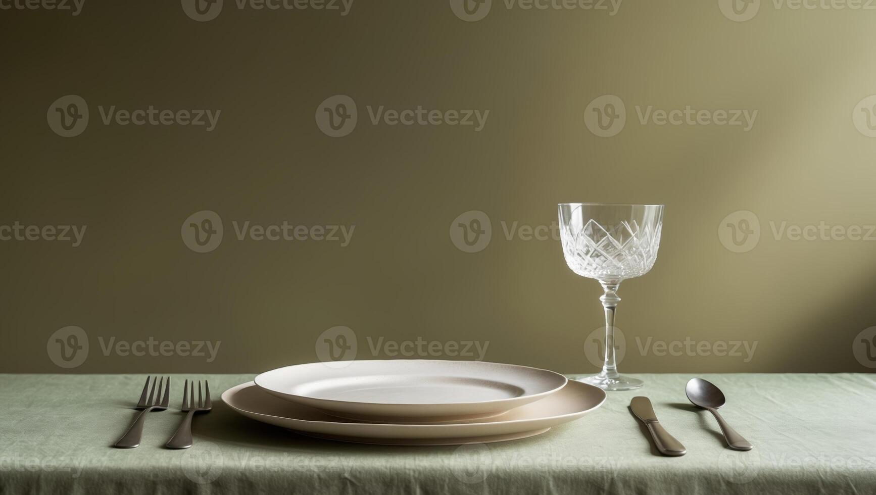 Elegant table setting for a formal dinner or special occasion in a soft-lit environment photo