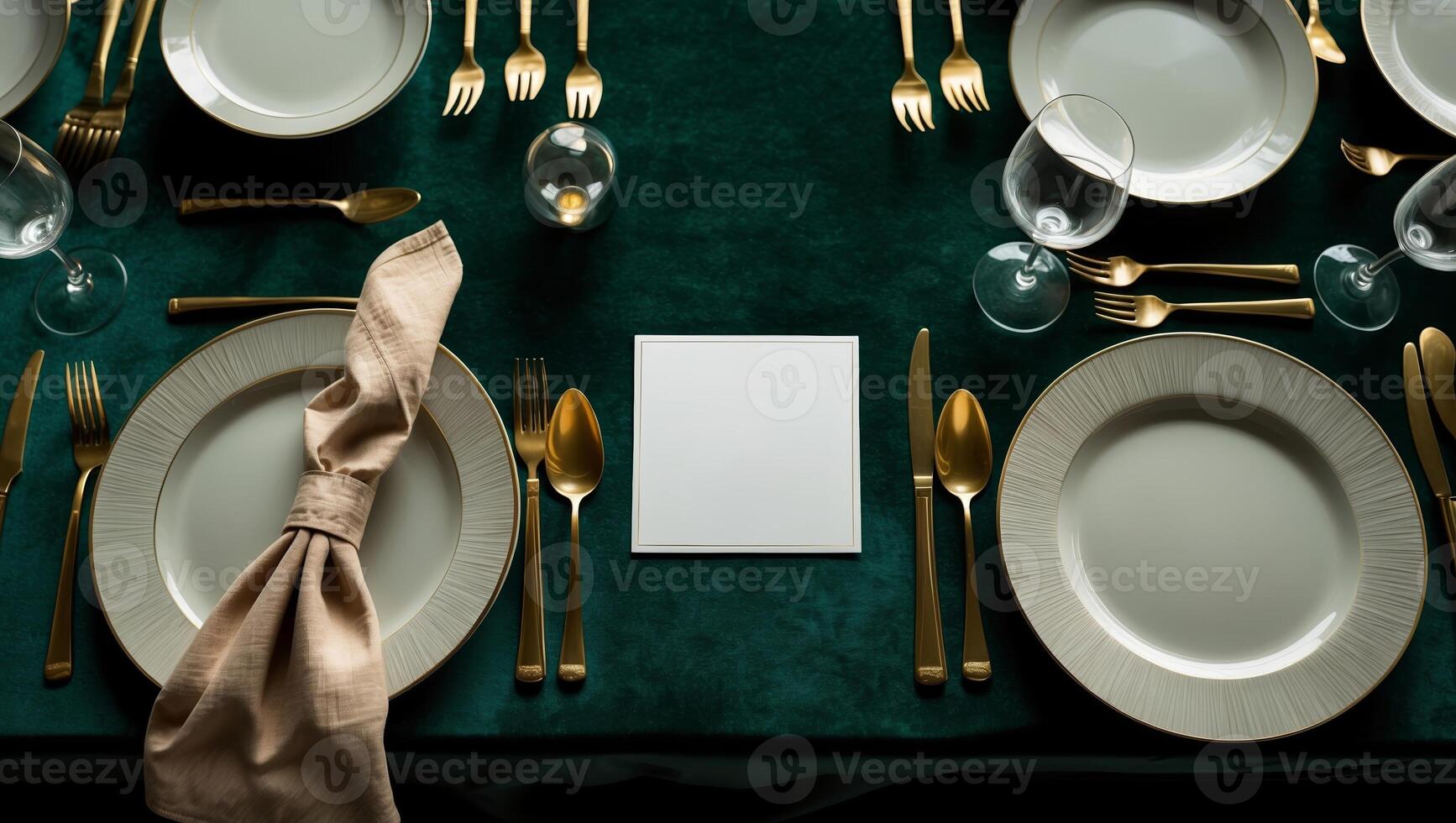 Elegant dining table setting in a formal atmosphere with gold cutlery and white plates photo