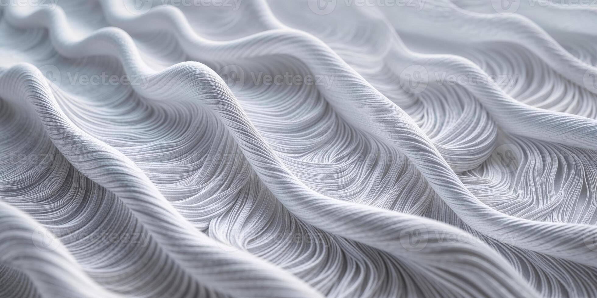 Delicate white fabric with elegant waves and textured patterns creating a sense of motion and softness in design photo