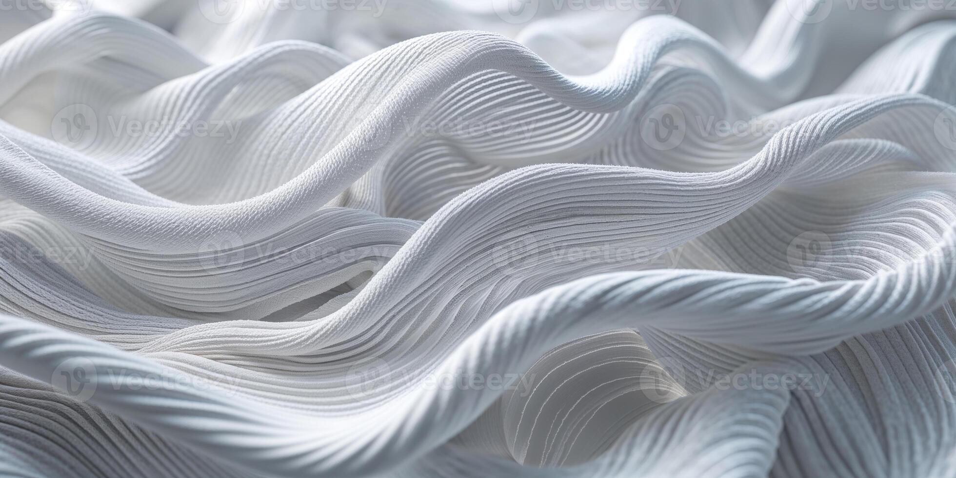 White fabric with intricate wave patterns creates a soft and elegant texture for various design applications photo