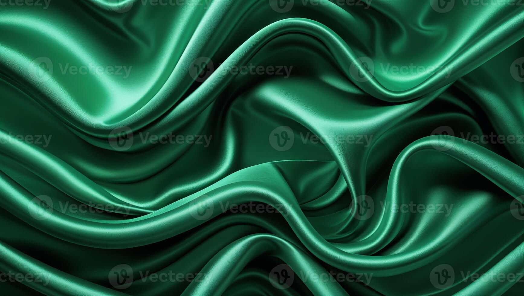 Luxurious green silk fabric drapes elegantly showcasing smooth texture and rich color variations photo