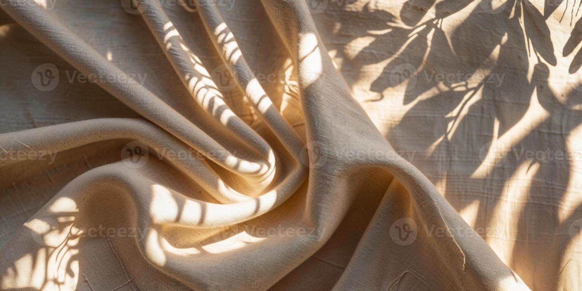 Beautifully draped fabric casting intricate shadows from nearby foliage in warm natural light photo