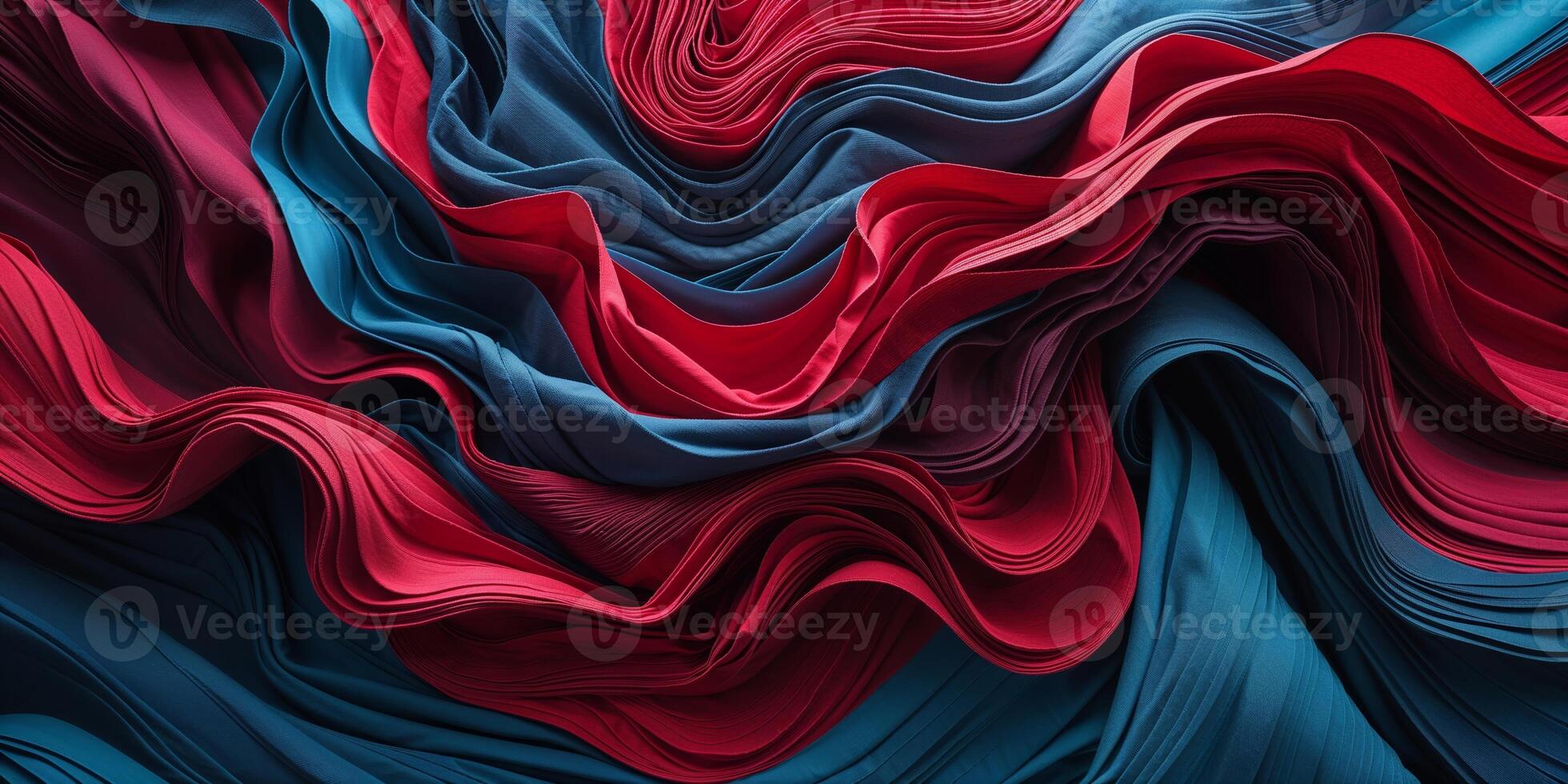Textured fabric waves in vibrant blue and red hues create an artistic display of color and form photo
