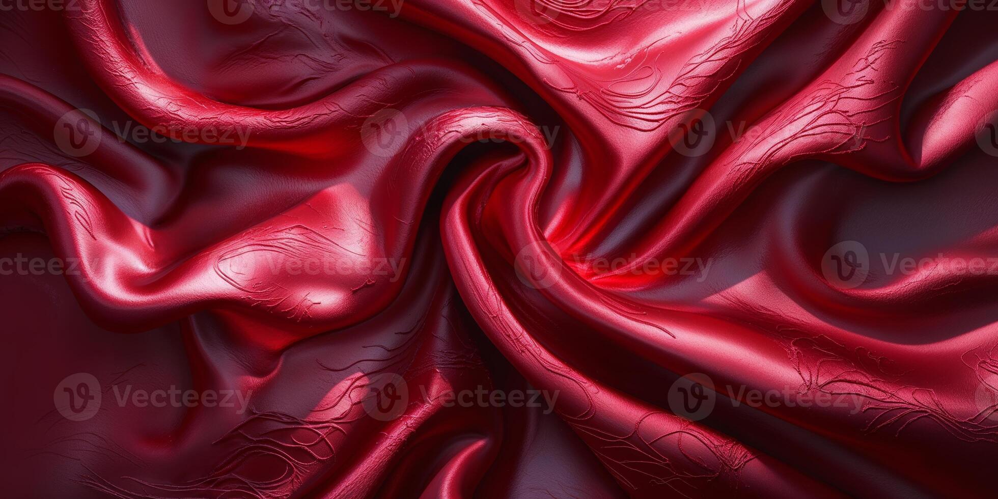 Elegant red silk fabric draped beautifully with intricate textures and smooth sheen in soft lighting photo