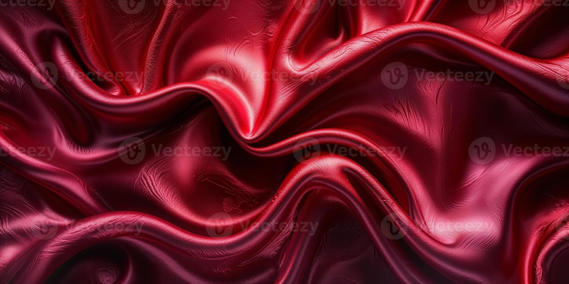 Rich red satin fabric draping elegantly with soft folds and curves, showcasing its luxurious texture and sheen in well-lit surroundings photo