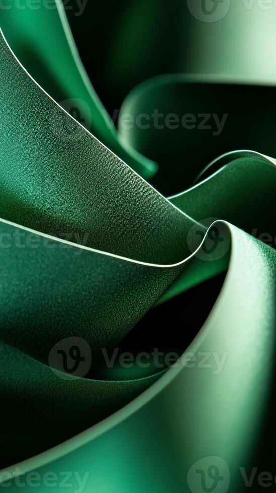 Rich green fabric drapes gracefully, showcasing smooth texture and delicate folds in abstract display of color and form photo