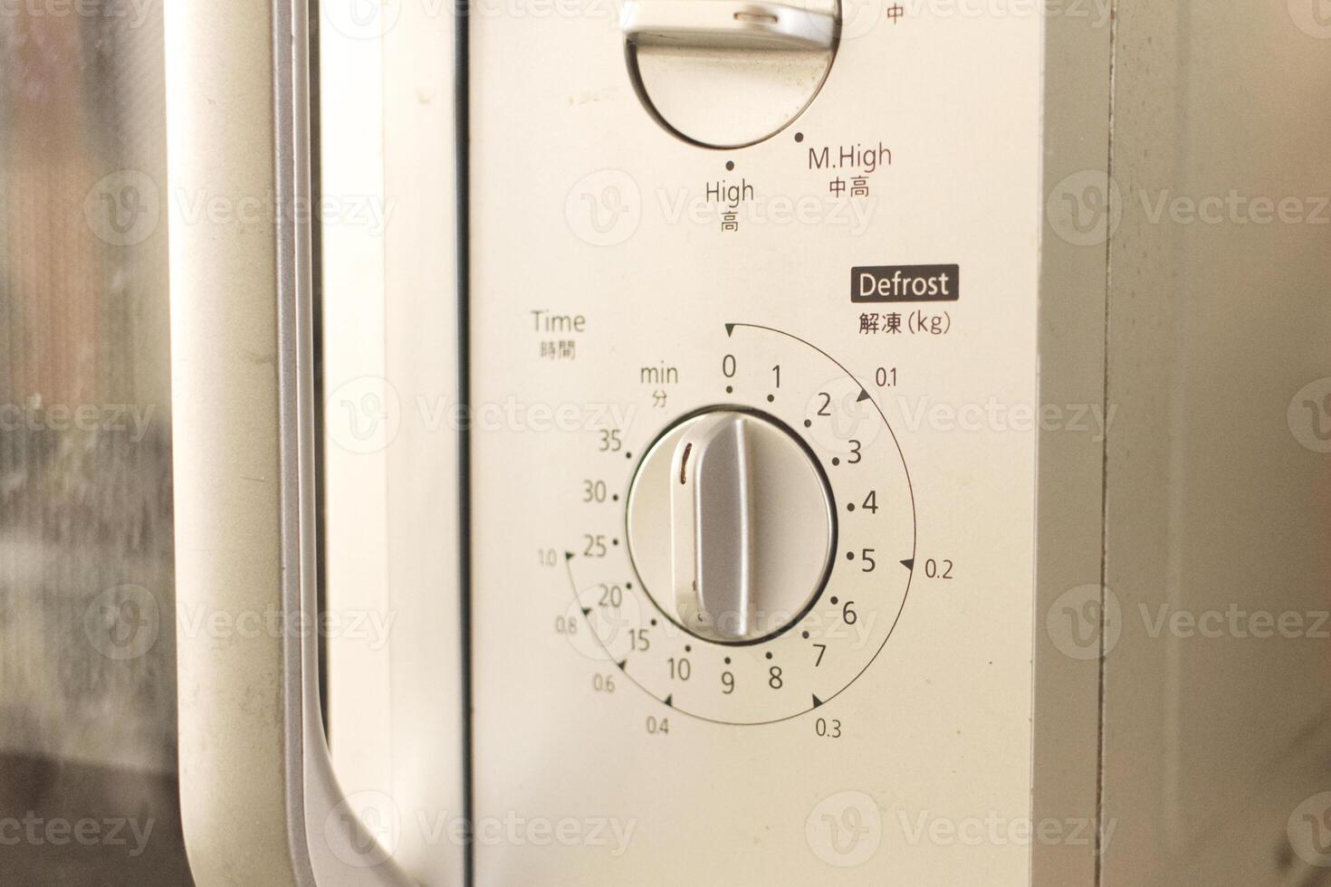 a close up view of the timer on the oven photo