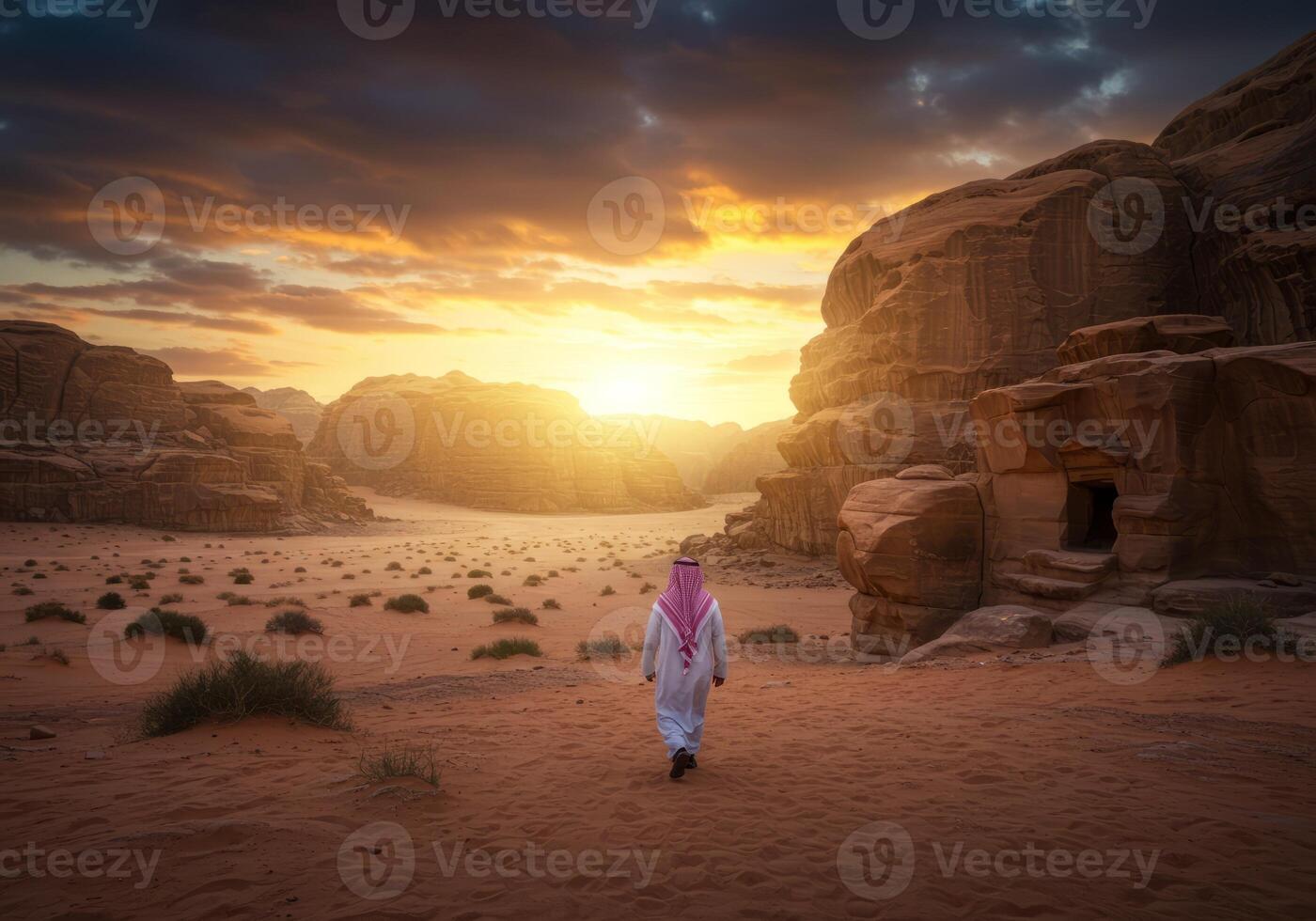 Man Walking in Desert Landscape at Sunset with Sandstone Rock Formations photo