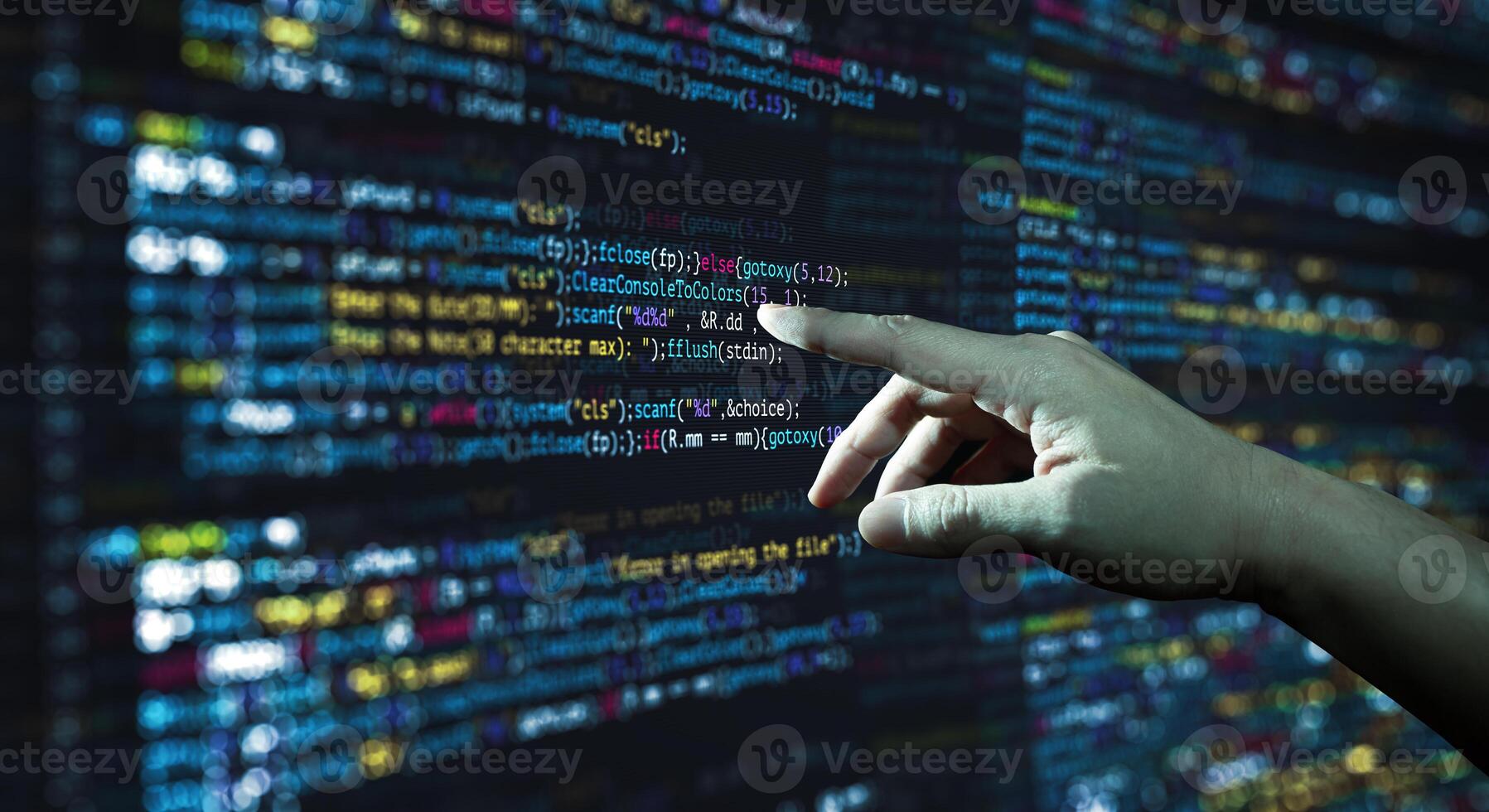 Human hand pointing at the abstract Modern tech of Programming code screen developer. photo