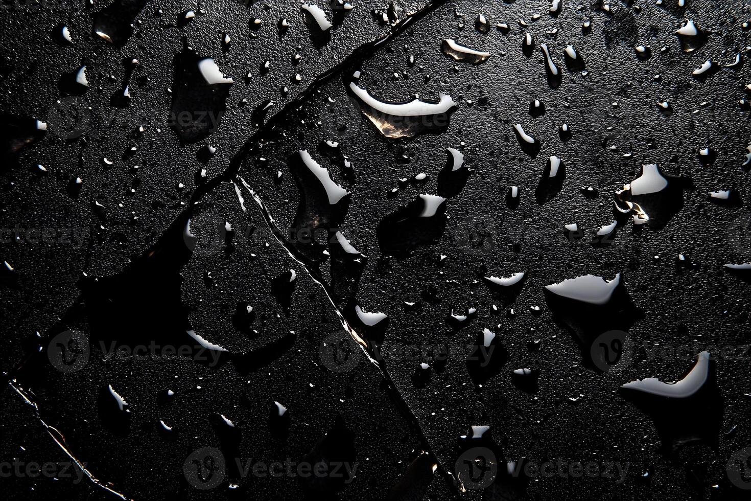 Dark stone surface with water droplets. photo