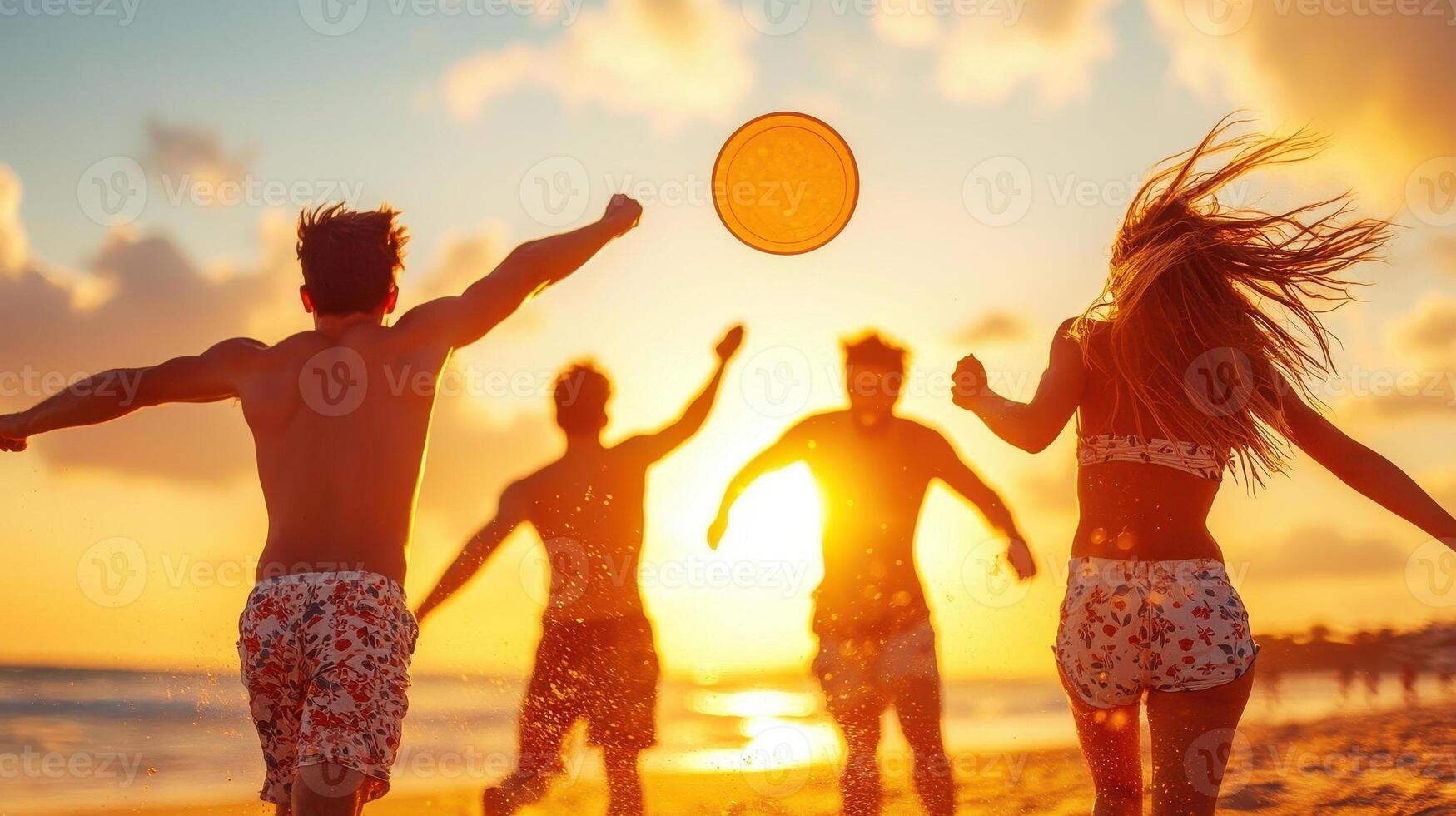Playing frisbee on beach during sunset, group of friends enjoys fun and energetic moment. warm colors of sky create joyful atmosphere photo