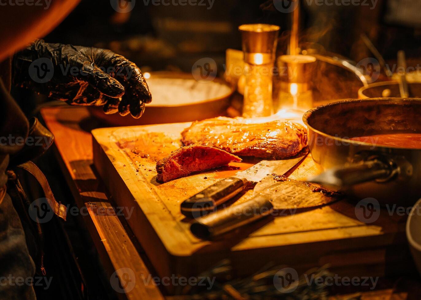 Cutting Midium Steak into Pieces with a Sharp Knife photo
