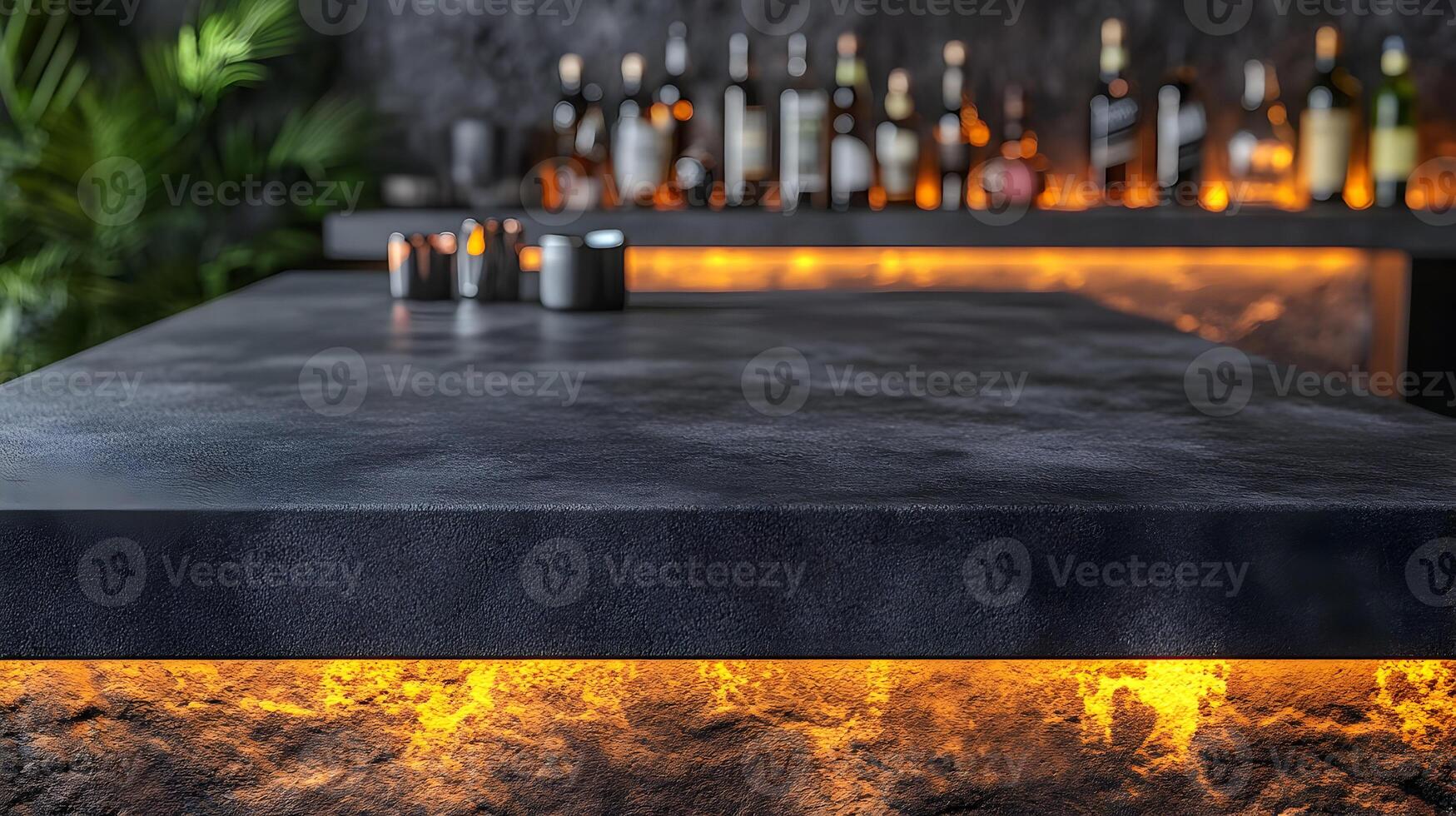 Empty dark bar counter with blurred bottles and warm lighting. photo