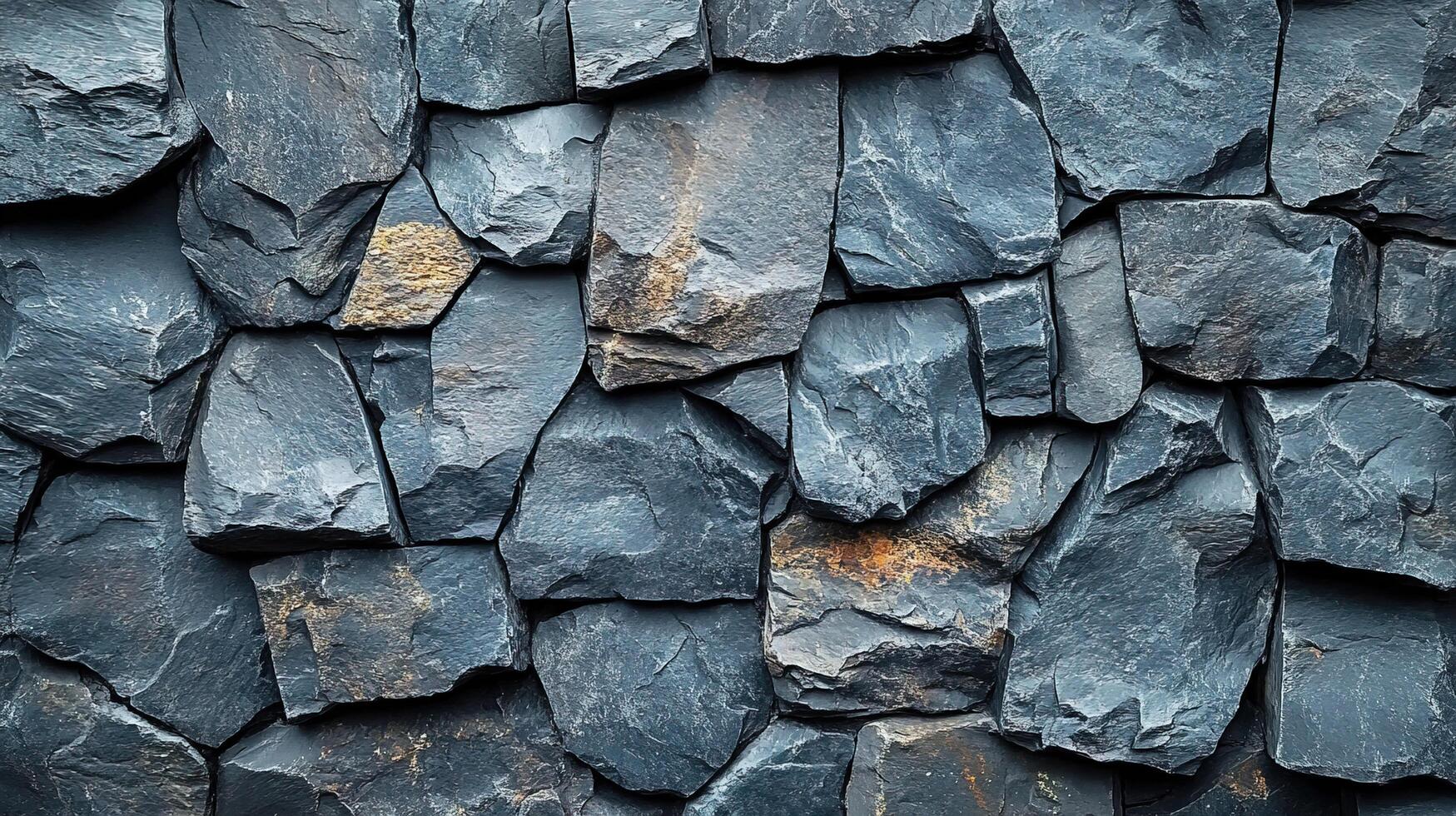 Dark gray uneven rock wall background, textured surface photo