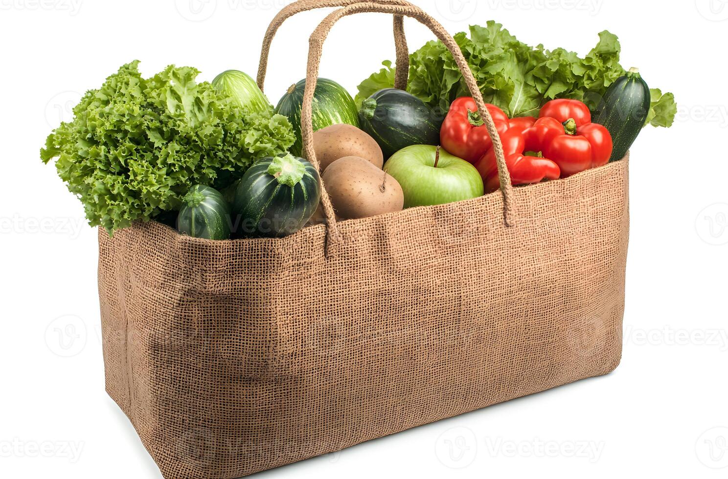 A burlap bag filled with fresh produce and vegetables photo