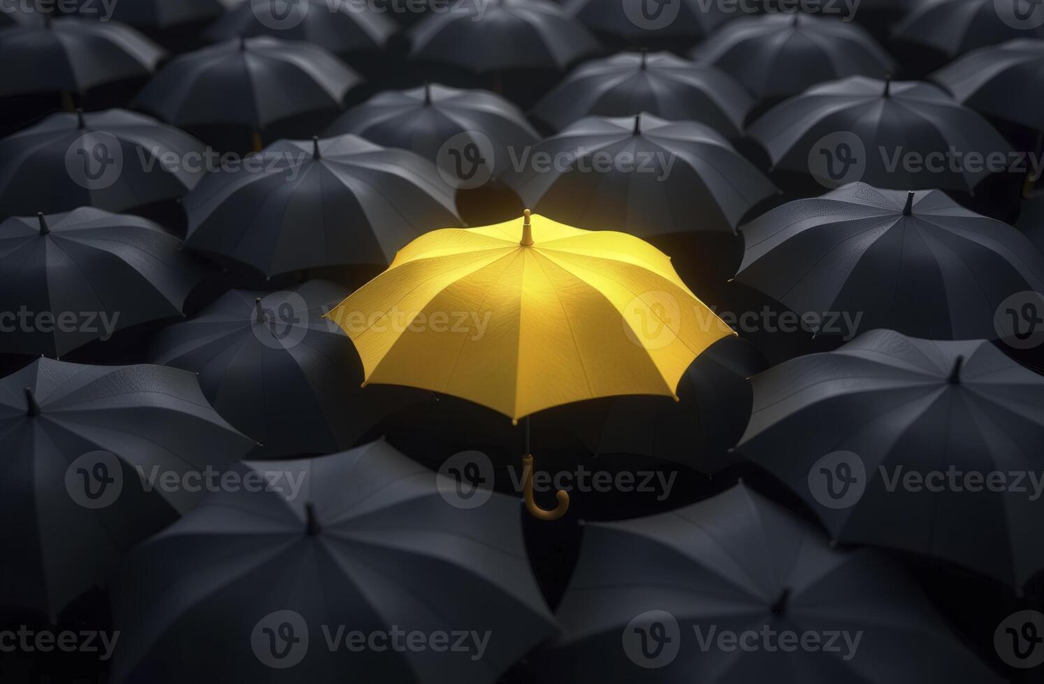 Yellow umbrella standing out from crowd of black umbrellas shows uniqueness and individuality photo