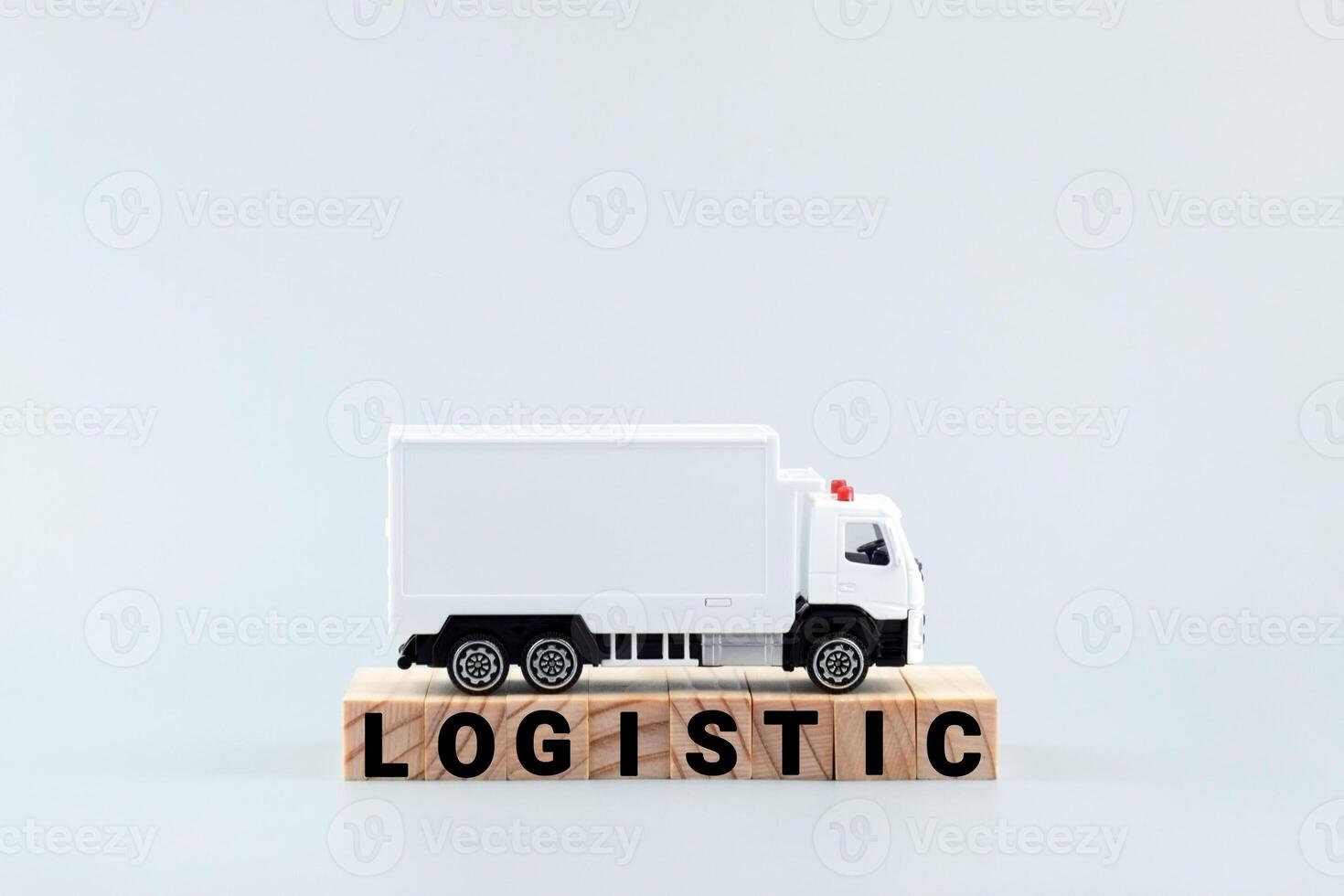 White toy truck on blocks with the text LOGISTIC. photo