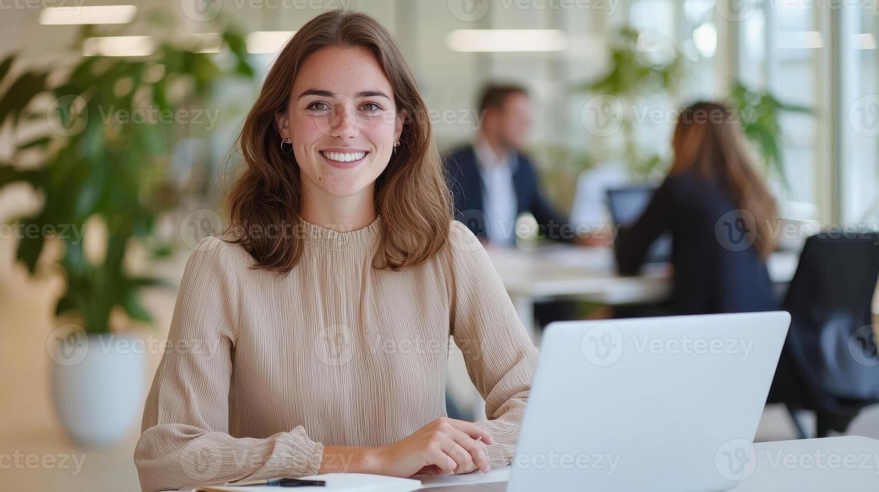 Woman sunlit developer working on desktop computer, surrounded by lush houseplants in business online office workspace with modern design photo