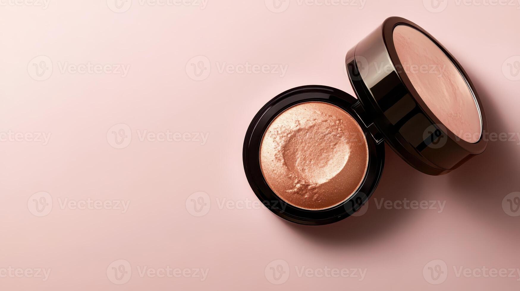 Compact makeup with shimmering powder open on soft pink background showcasing beauty essentials for flawless skin photo