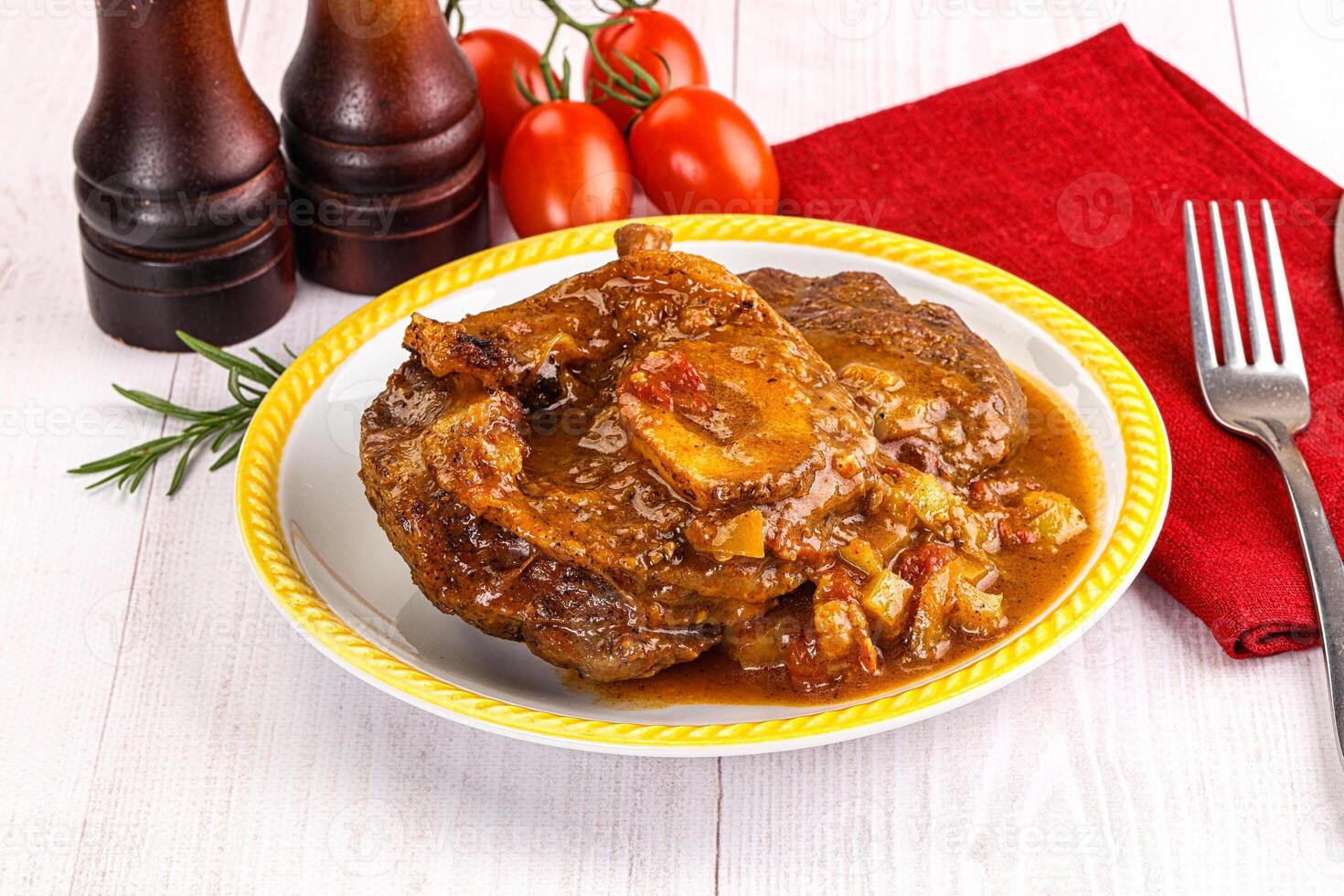 A plate of food with a fork and knife photo