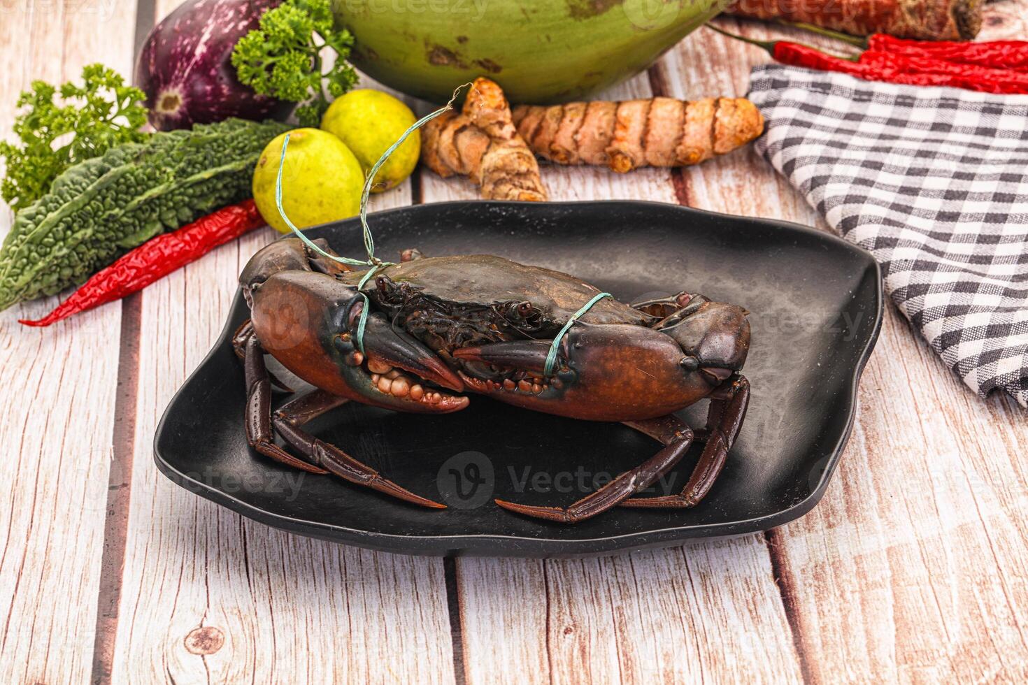 A black plate with a crab on it photo