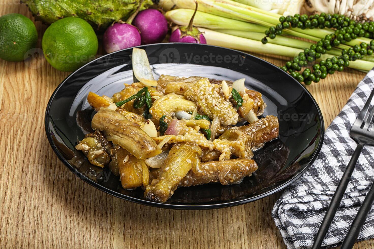 A plate of food with vegetables and a fork photo