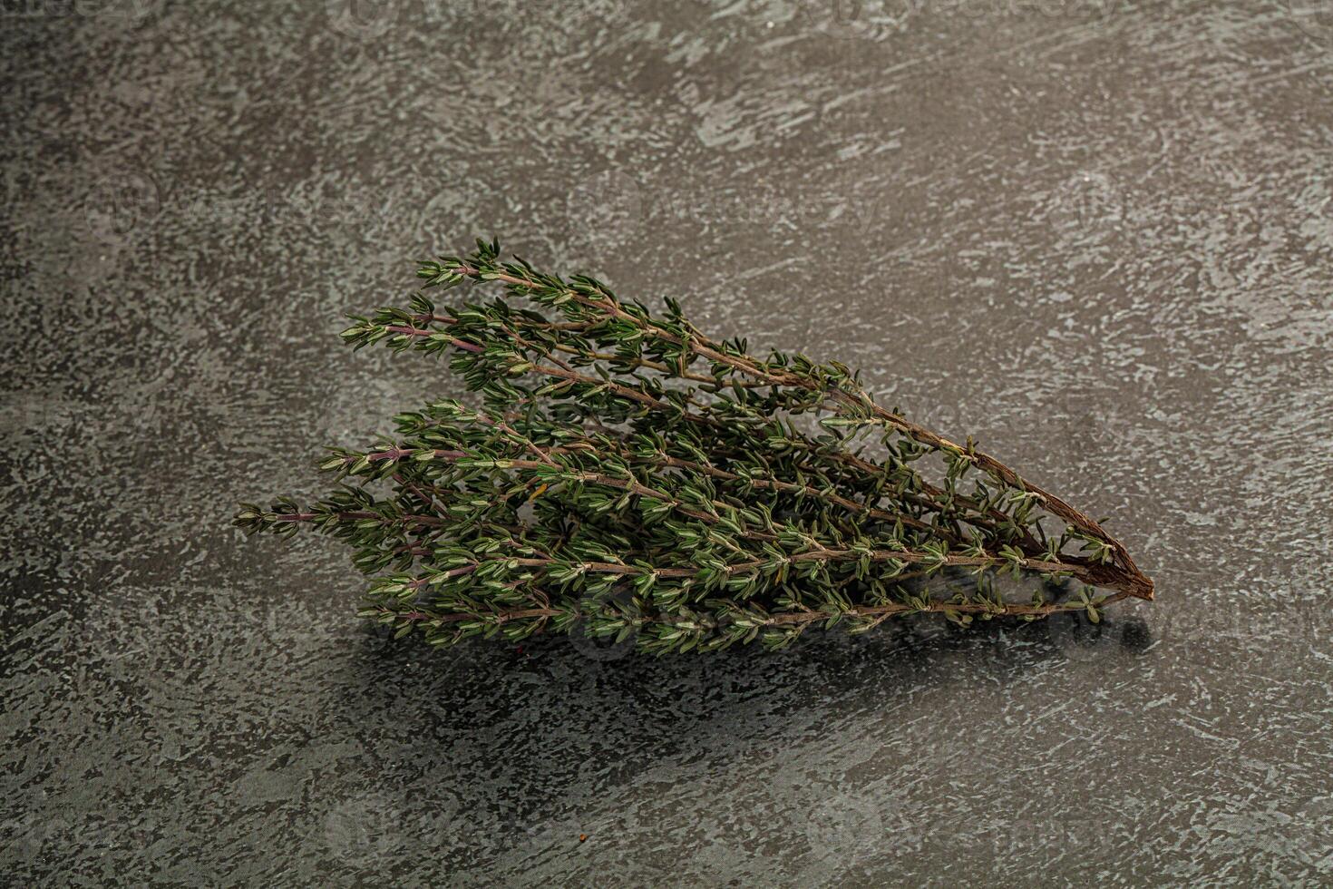 A bunch of herbs on a table photo