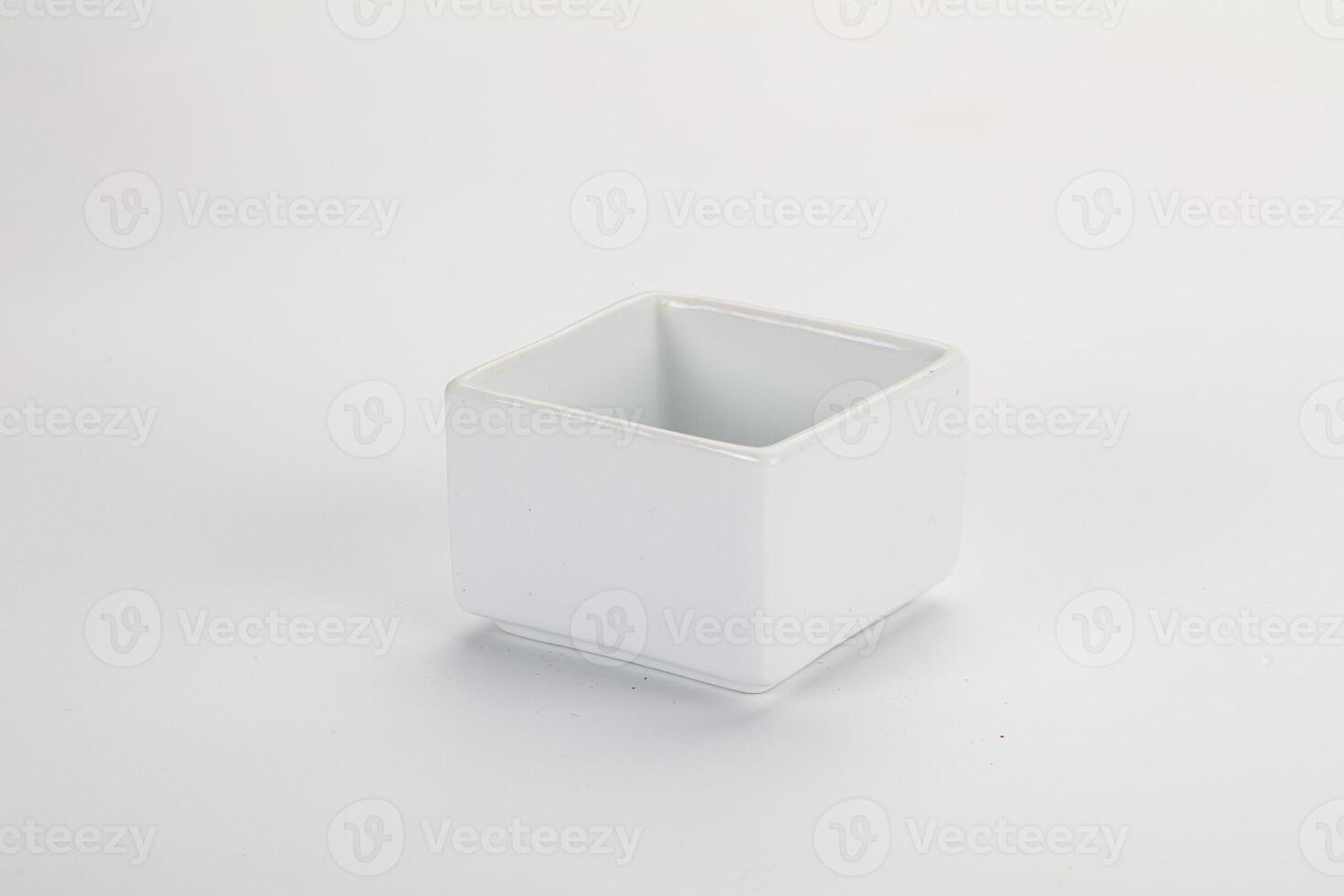 A white square container with a small lid photo