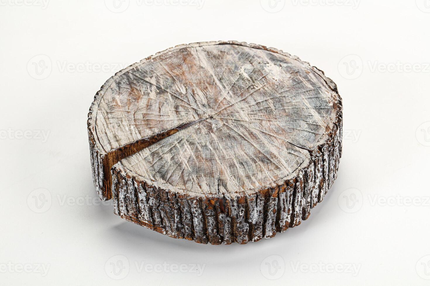A close up of a tree stump with a slice taken out of it photo