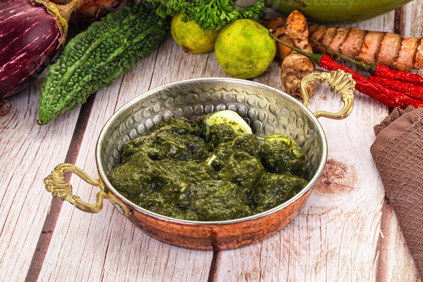 A bowl of green food on a table photo