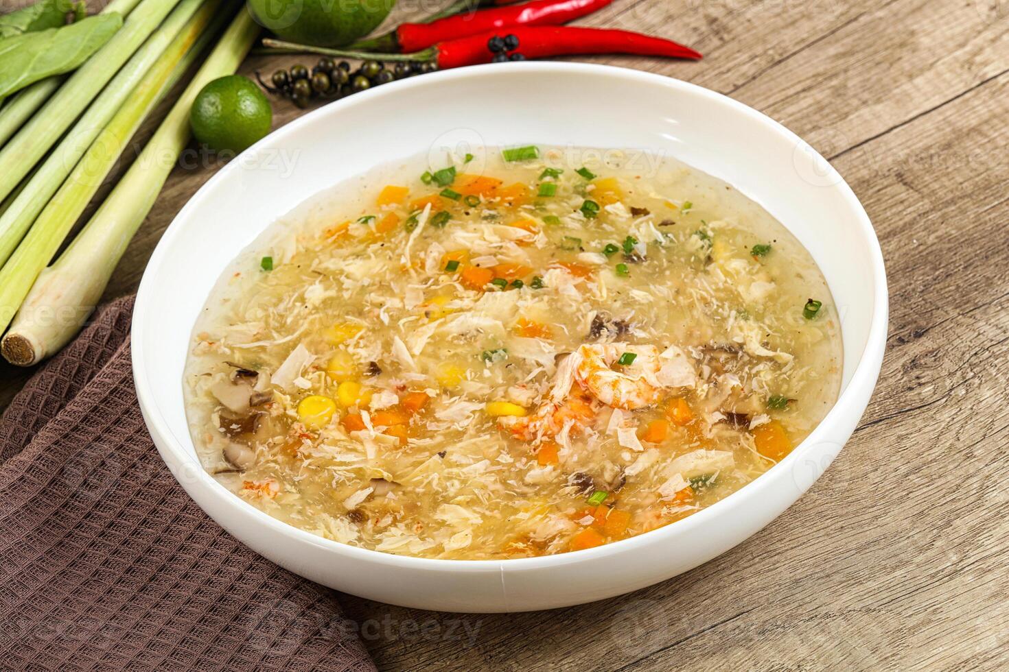 A bowl of soup with vegetables and other ingredients photo