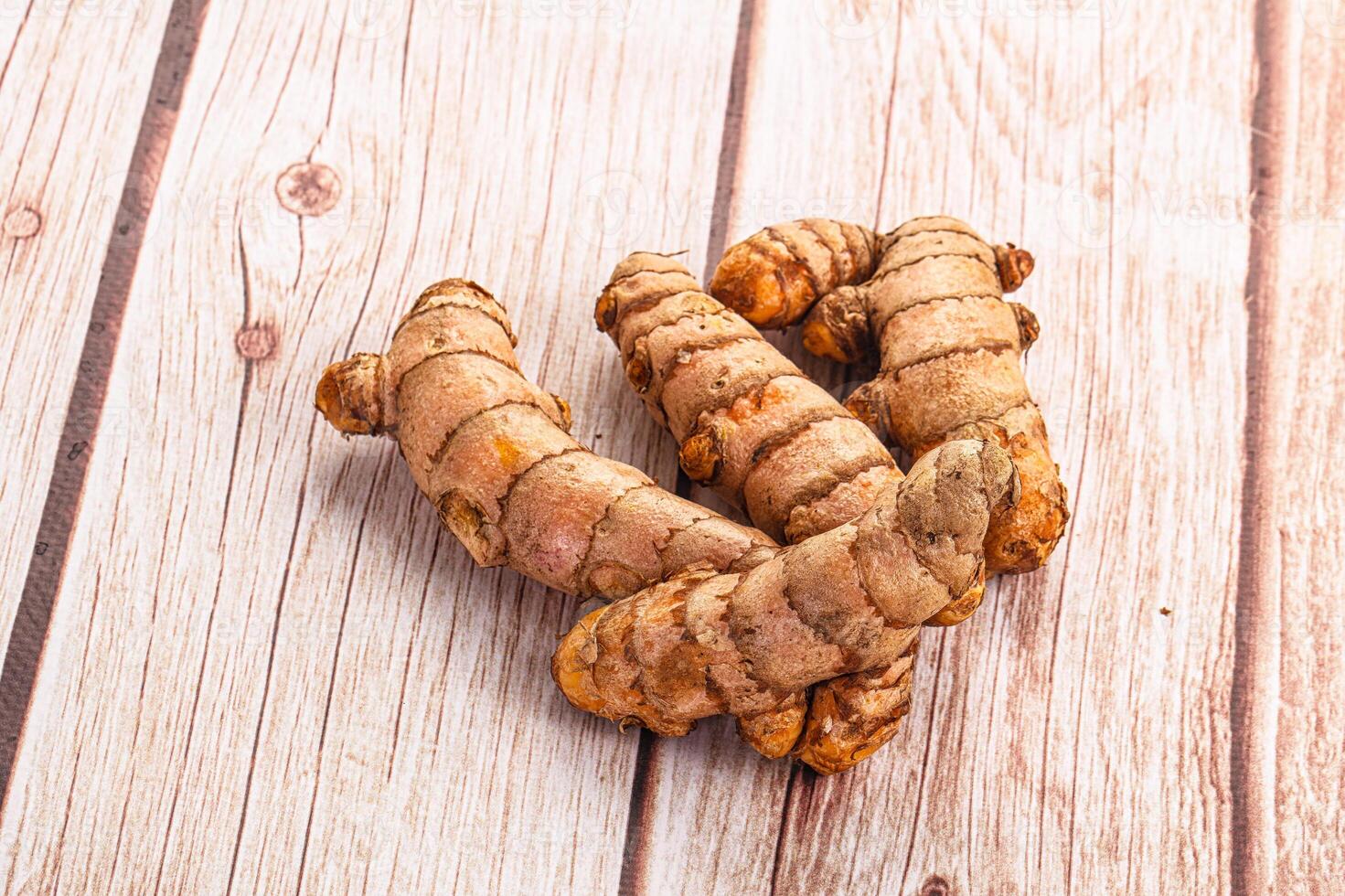 A close up of ginger root on a wooden table photo