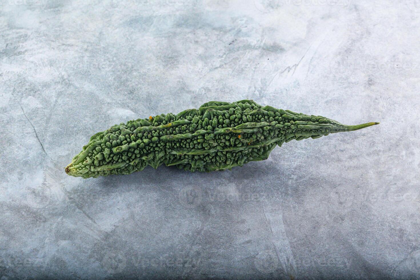 A green vegetable on a gray surface photo