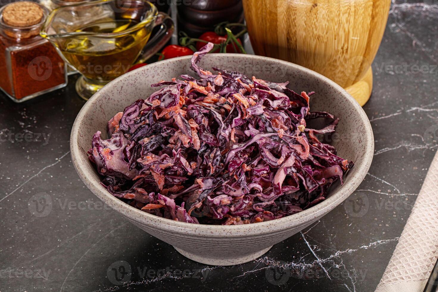 A bowl of red cabbage sitting on a table photo