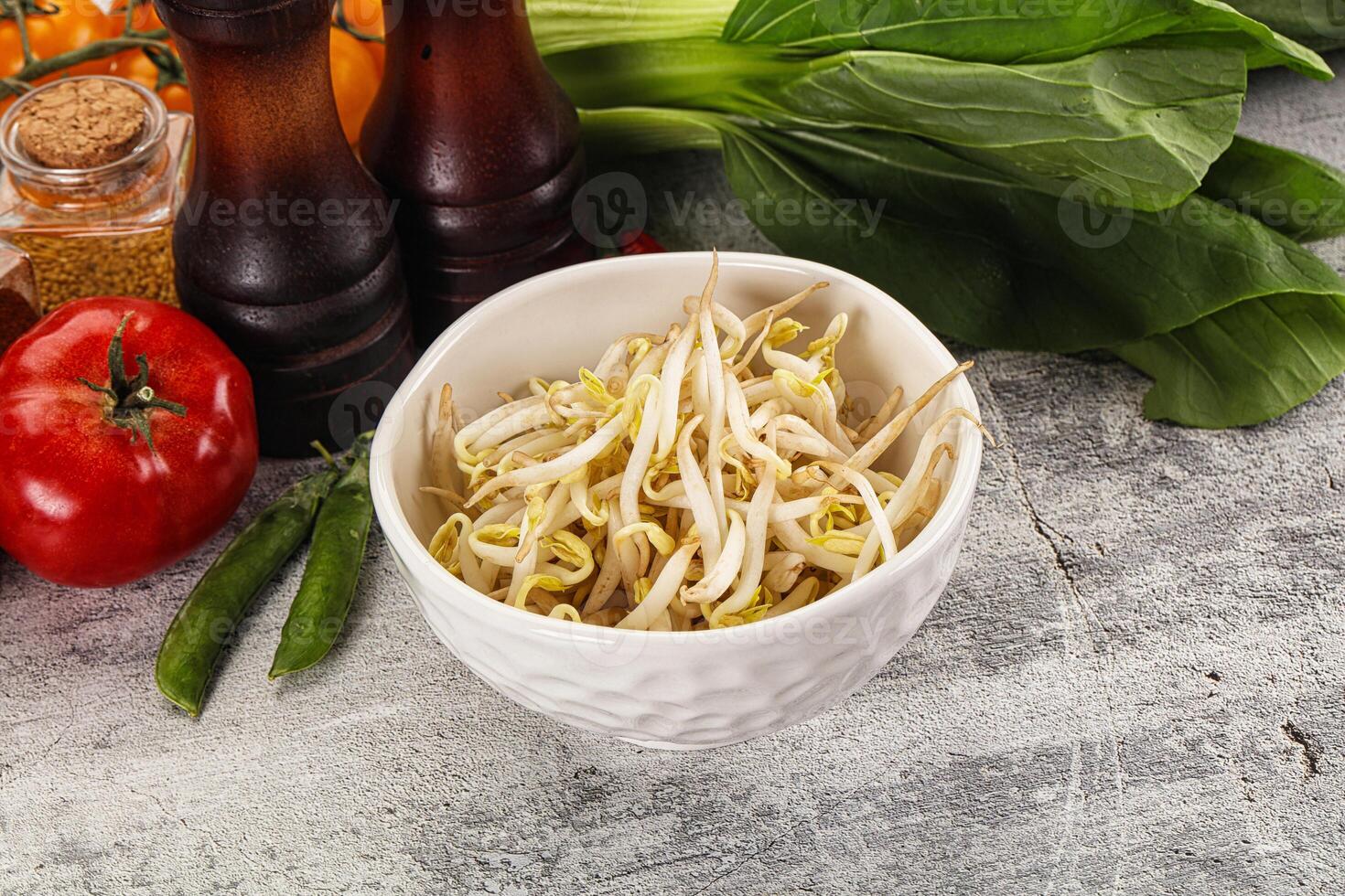A bowl of noodles with vegetables and spices photo