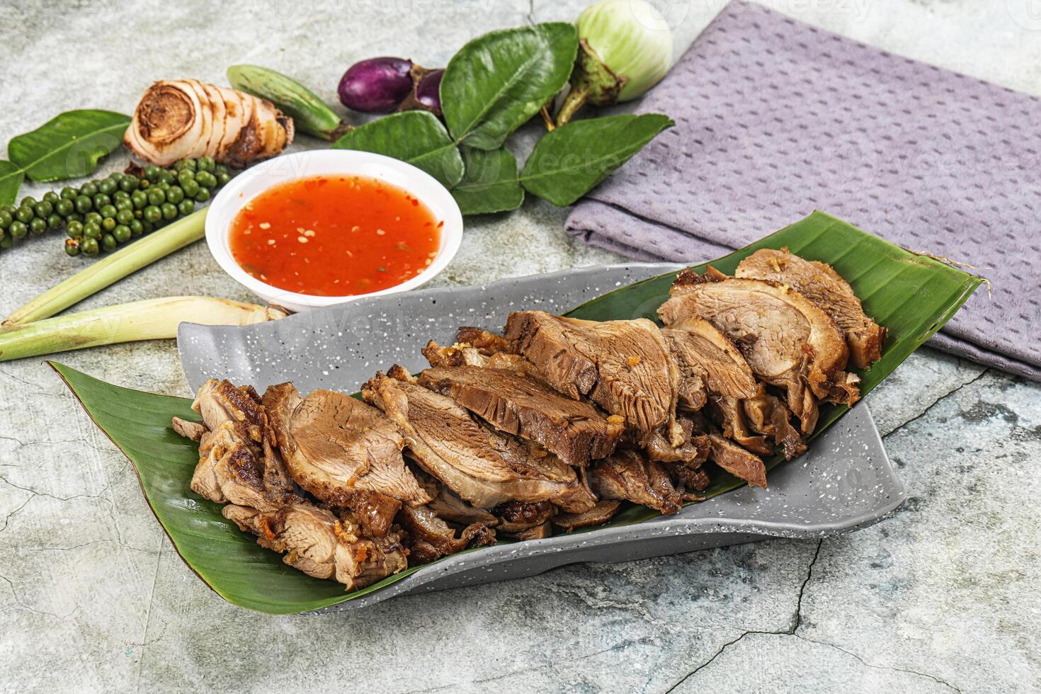 A plate with meat and vegetables on it photo