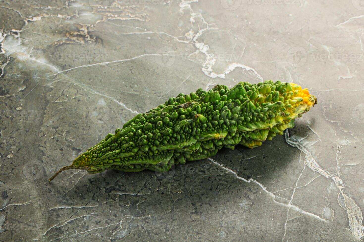 A green plant on a marble surface photo
