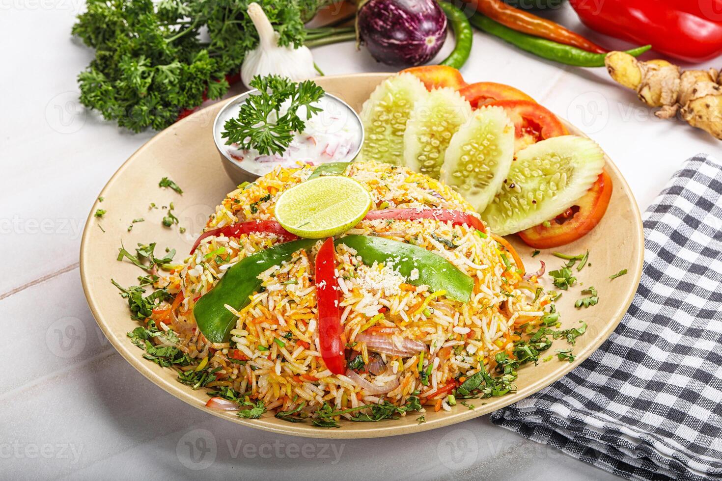 A plate of food with vegetables and a knife photo